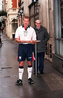 ALAN SHEARER MODELLING THE NEW 1997 ENGLAND HOME STRIP AND HOLDING A ALAN SHEARER MODELLING THE NEW 1997 ENGLAND HOME STRIP AND HOLDING A