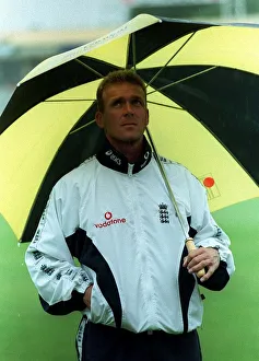 Alecd Stewart England Cricket Captain June 1998 stands under an umbrella at Alecd Stewart England Cricket Captain June 1998 stands under an umbrella at