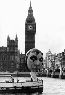 Alice Cooper American rock singer with balloon sailing past Big Ben Alice Cooper American rock singer with balloon sailing past Big Ben