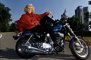 Alison Holloway TV Presenter sitting on her Harley Davidson in Hyde Park Alison Holloway TV Presenter sitting on her Harley Davidson in Hyde Park