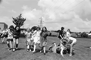 All fall down! Contestants in the three-legged race at Scissett C of E First SchoolA¿ All fall down! Contestants in the three-legged race at Scissett C of E First SchoolA¿