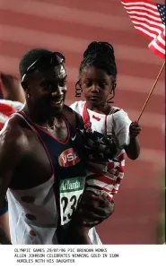 Allen Johnson celebrates with his daughter after winning the gold medal in the 110 metres Allen Johnson celebrates with his daughter after winning the gold medal in the 110 metres