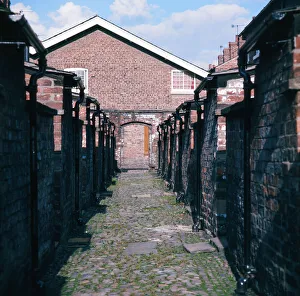 Back alley at cottages at the restored Quarry Bank Mill in Styal, Cheshire, 1973 Back alley at cottages at the restored Quarry Bank Mill in Styal, Cheshire, 1973