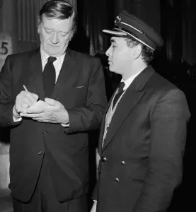 American actor John Wayne leaving the Ambassadeurs Club in Hamilton Place American actor John Wayne leaving the Ambassadeurs Club in Hamilton Place