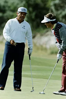 American golfer Lee Trevino talking to another player who is about to take putt American golfer Lee Trevino talking to another player who is about to take putt
