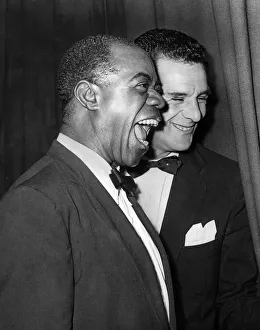 American jazz musician Louis Armstrong smiles as he receives cheers from his Glasgow fans American jazz musician Louis Armstrong smiles as he receives cheers from his Glasgow fans