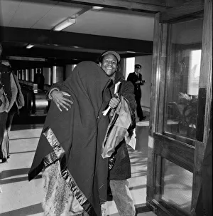 American pop artist Prince leaving Britain with a blanket over his head American pop artist Prince leaving Britain with a blanket over his head