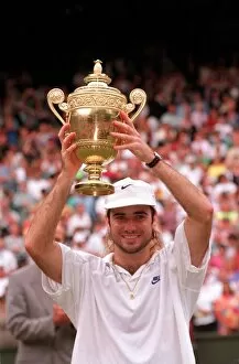 Images Dated 6th July 1992: ANDRE AGASSI HOLDING THE TROPHY IN THE WIMBLEDON TENNIS 1992 FINAL - 06 / 07 / 1992