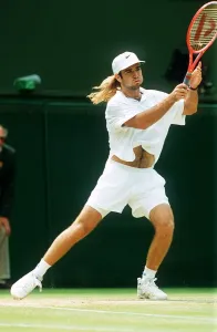 Andre Agassi plays John McEnroe in the Men's Singles Semi-Final Tennis at Wimbledon Andre Agassi plays John McEnroe in the Men's Singles Semi-Final Tennis at Wimbledon
