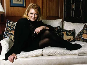 Angie Dickinson American Actress sitting with feet up on sofa Angie Dickinson American Actress sitting with feet up on sofa