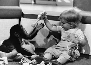 Animals - Children with Monkeys. Sharing....Benje plays with his new friend Jemma Heath Animals - Children with Monkeys. Sharing....Benje plays with his new friend Jemma Heath