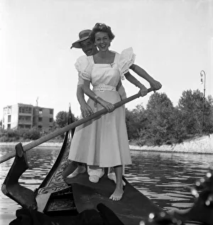 Ann French, actress posing with a gondolier in Venice, Italy. September 1952 C4555 Ann French, actress posing with a gondolier in Venice, Italy. September 1952 C4555