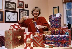 Images Dated 8th October 1991: Anne Gregg TV Presenter at her home in Twickenham Surrey wrapping Presents