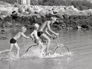 Arctic Summer in Northern Norway Children playing in the sea during one of Arctic Summer in Northern Norway Children playing in the sea during one of