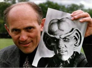 Armin Shimerman American Actor Holding A Picture Of Quark Who He Stars As In Star Trek Armin Shimerman American Actor Holding A Picture Of Quark Who He Stars As In Star Trek