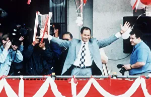 Arsenal manager George Graham shows off European cup winners cup trophy to crowds of Arsenal manager George Graham shows off European cup winners cup trophy to crowds of