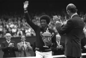 Arthur Ashe waves to fans after winning mens title in 1975 at Wimbledon with Duke of Kent Arthur Ashe waves to fans after winning mens title in 1975 at Wimbledon with Duke of Kent