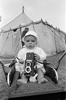 A baby sitting with a Rolleiflex camera at Skelton annual baby show. Circa 1973 A baby sitting with a Rolleiflex camera at Skelton annual baby show. Circa 1973