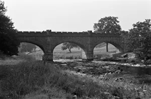 Barden Aqueduct and footbridge, crossing the River Wharfe, North Yorkshire Barden Aqueduct and footbridge, crossing the River Wharfe, North Yorkshire