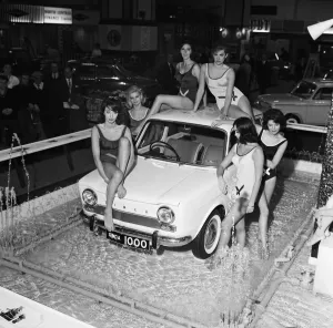 Bathing beauties with the new Simca 1000 in display fountains at the Earls Court Motor Bathing beauties with the new Simca 1000 in display fountains at the Earls Court Motor