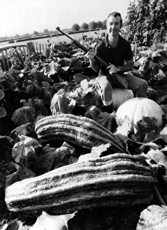 Beady Eyed David Payne sits astride one of his marrows, on the lookout Beady Eyed David Payne sits astride one of his marrows, on the lookout