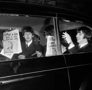 The Beatles leaving The Daily Mirror Golden Ball each with a copy of the paper The Beatles leaving The Daily Mirror Golden Ball each with a copy of the paper