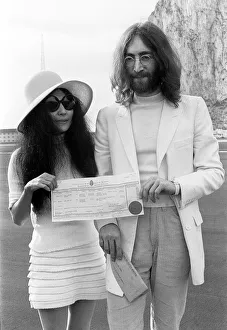 Beatles singer John Lennon and his new bride Yoko Ono holding their marriage certificate Beatles singer John Lennon and his new bride Yoko Ono holding their marriage certificate