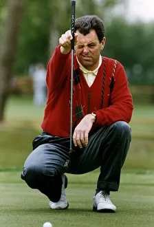 Bernard Gallacher Golf lining up a putt on the green Bernard Gallacher Golf lining up a putt on the green