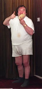 Bernard Manning comedian eating a Walls Arctic Roll dessert. September 1997 Bernard Manning comedian eating a Walls Arctic Roll dessert. September 1997