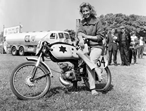Beryl Swain waiting to weigh in for the 50cc race. 7th June 1962 Beryl Swain waiting to weigh in for the 50cc race. 7th June 1962