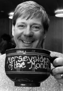 Billy Butler raises a smile and a cup of tea for the Merseyside of the Month competition Billy Butler raises a smile and a cup of tea for the Merseyside of the Month competition