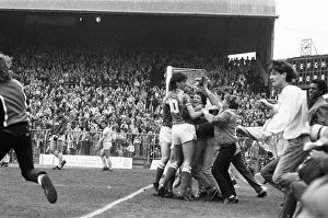 Birmingham City players mobbed by jubilant fans who have run onto the pitch as they Birmingham City players mobbed by jubilant fans who have run onto the pitch as they