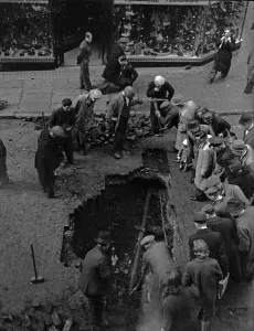 Birmingham residents inspect a bomb crater in Corporation Street, Birmingham Birmingham residents inspect a bomb crater in Corporation Street, Birmingham