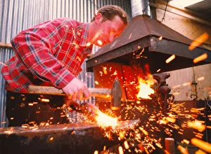 Blacksmith Craig Knowles at work in his forge Blacksmith Craig Knowles at work in his forge
