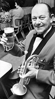 Bob Dunning a member of the Ashington Colliery Band raises his glass in a toast to his Bob Dunning a member of the Ashington Colliery Band raises his glass in a toast to his