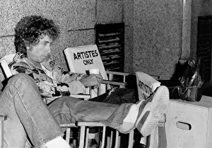 Bob Dylan American singer songwriter with his feet up on a film set for Hearts of Desire Bob Dylan American singer songwriter with his feet up on a film set for Hearts of Desire