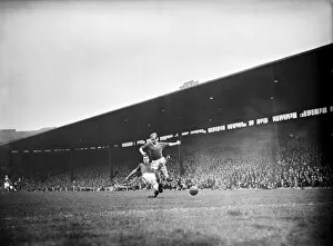 Bobby Charlton leaps to elude a defender during the match between Manchester United Bobby Charlton leaps to elude a defender during the match between Manchester United
