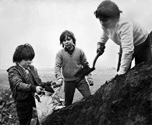 Boy miners digging for coal in the old mine at Cobridge North Staffordshire Boy miners digging for coal in the old mine at Cobridge North Staffordshire
