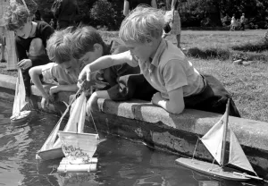 Four Boys enjoy a bit of model boat sailing during an open day at Bilton Grange boarding Four Boys enjoy a bit of model boat sailing during an open day at Bilton Grange boarding