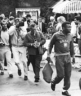 Brazilian football star Pele surrounded by photographers Brazilian football star Pele surrounded by photographers