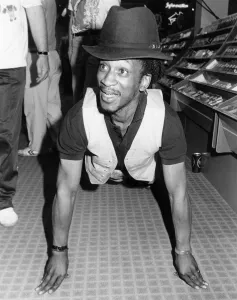 Brinsley from Aswad took part in a charity event, filling dustbins with albums to raise Brinsley from Aswad took part in a charity event, filling dustbins with albums to raise