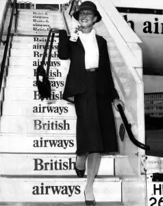 British Airways stewardesses show off a classic and elegant new uniform designed by top British Airways stewardesses show off a classic and elegant new uniform designed by top