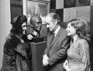 British author Alistair MacLean with his wife Mary Arden (woman in hat British author Alistair MacLean with his wife Mary Arden (woman in hat