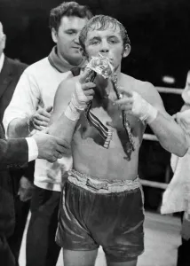 British bantamweight champion boxer Alan Rudkin celebrates by kissing his belt following British bantamweight champion boxer Alan Rudkin celebrates by kissing his belt following