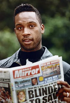 British boxer Nigel Benn with a copy of the Daily Mirror. 3rd July 1992 British boxer Nigel Benn with a copy of the Daily Mirror. 3rd July 1992