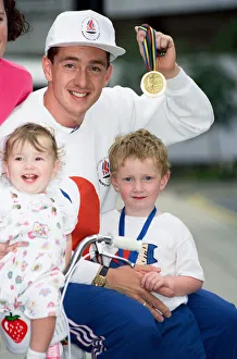 British cyclist Chris Boardman poses with his family on arrival at Manchester airport as British cyclist Chris Boardman poses with his family on arrival at Manchester airport as