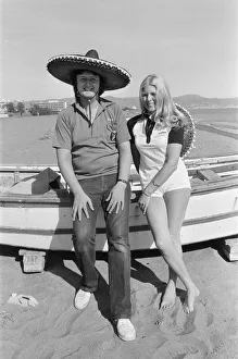 British darts player Eric Bristow poses with Maureen Flowers on the beach at Torremolinos British darts player Eric Bristow poses with Maureen Flowers on the beach at Torremolinos