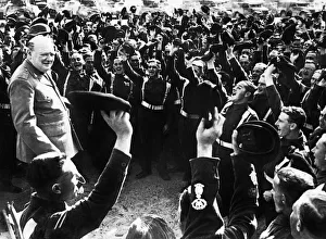 British Prime Minister Winston Churchill is cheered by men of the 4th Hussars after his British Prime Minister Winston Churchill is cheered by men of the 4th Hussars after his