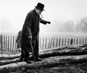 British Prime Minister Winston Churchill walking up one of the greasy inclined logs used British Prime Minister Winston Churchill walking up one of the greasy inclined logs used