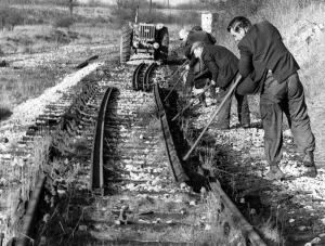 British Railways workmen lever a length of rail from its chairs on the old Nuneaton-Ashby British Railways workmen lever a length of rail from its chairs on the old Nuneaton-Ashby